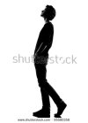 stock-photo-young-man-walking-looking-up-silhouette-in-studio-isolated-on-white-background-95580358